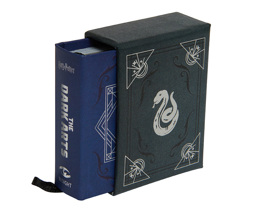 Hardcover edition of Harry Potter: The Dark Arts book with jacket by Insight Editions, featuring dark, mystical cover art.