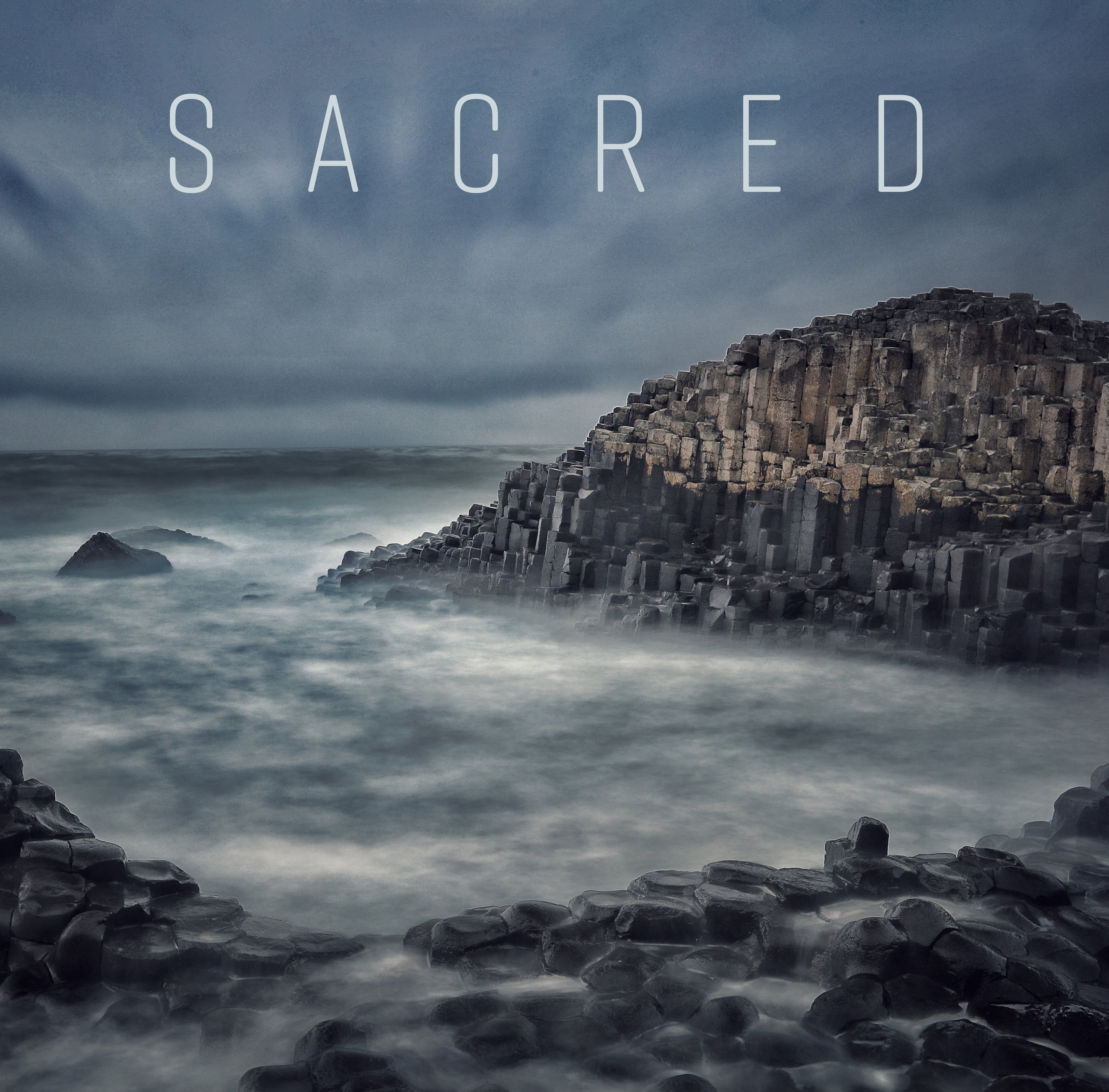Hardcover book titled "Sacred" with a protective jacket, published by Insight Editions, featuring a detailed cover design.
