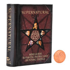 Open hardcover edition of Supernatural: Mini Guide to Saving People and Hunting Things with jacket, featuring detailed interior pages.