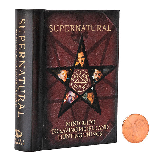 Open hardcover edition of Supernatural: Mini Guide to Saving People and Hunting Things with jacket, featuring detailed interior pages.