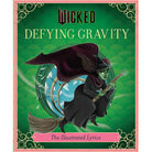 Hardcover edition of "Wicked: Defying Gravity" with jacket, published by Insight Editions, showing the book cover artwork.