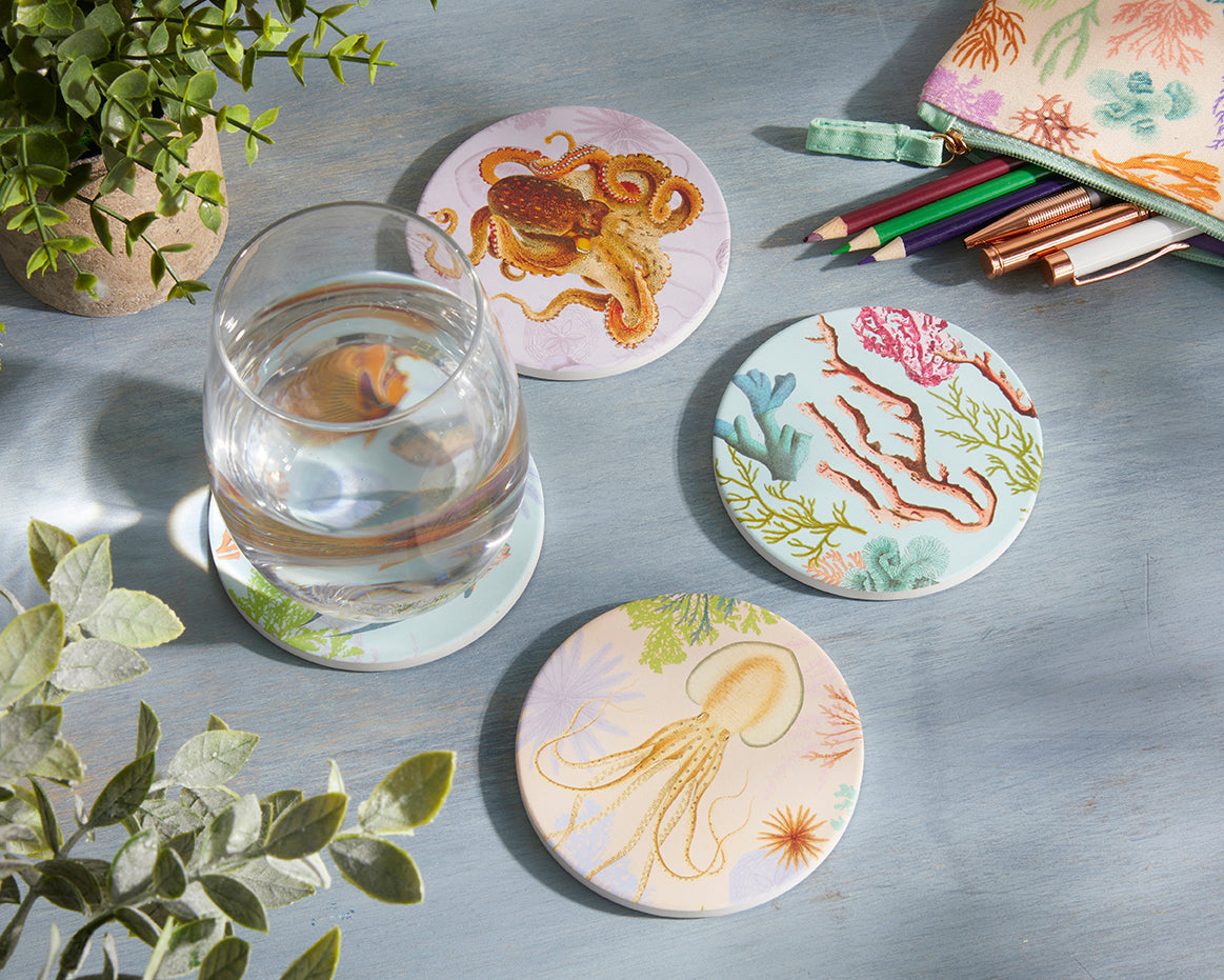 Set of four Art of Nature Under the Sea coaster set by Insight Editions, featuring ocean-themed designs for home decor.