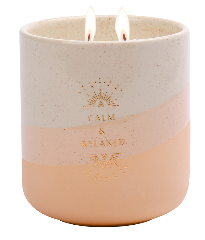 Calm scented candle in 11 oz. container by Insight Editions, cozy home decor with relaxing aroma.