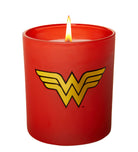 Wonder Woman glass candle featuring DC Comics design, placed on a home decor surface, showcasing vibrant colors and detailed artwork.