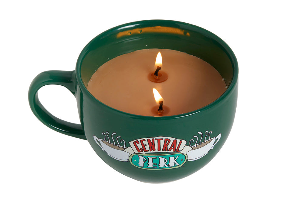Friends Central Perk coffee cup candle from Insight Editions, featuring a cozy ceramic mug with Central Perk branding.
