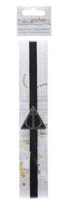 Harry Potter Deathly Hallows enamel charm bookmark from Insight Editions, featuring a detailed magical symbol design.