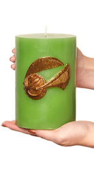 Harry Potter Golden Snitch sculpted insignia candle, detailed home decor item, featuring a gold-colored Snitch design from Insight Editions.
