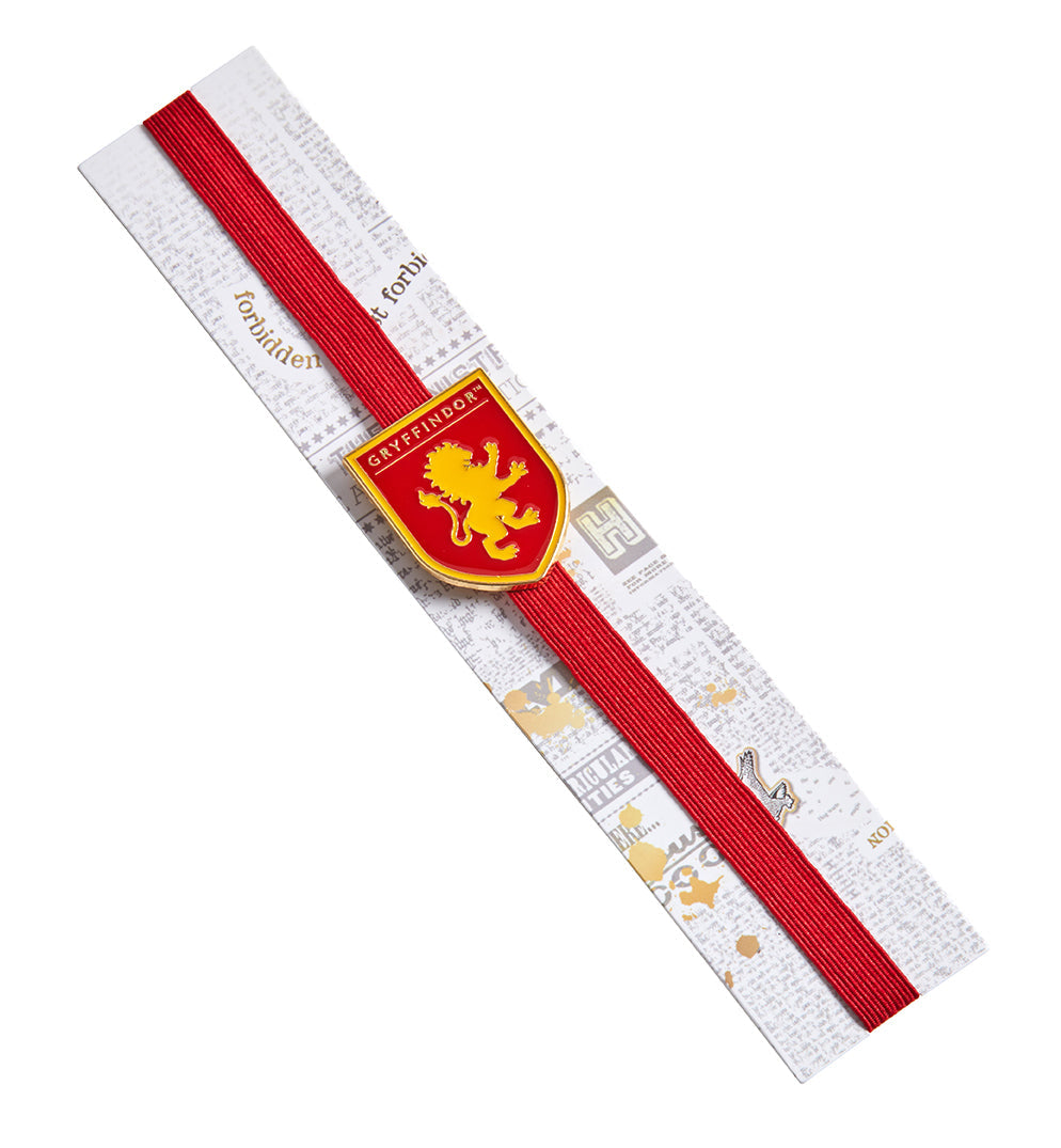 Gryffindor enamel charm bookmark from Harry Potter series featuring the house crest and colors, by Insight Editions.