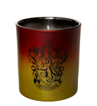 Gryffindor glass candle from Harry Potter home goods by Insight Editions featuring the Hogwarts crest and red and gold design.