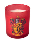 Gryffindor scented glass candle from Harry Potter home goods collection by Insight Editions, featuring a decorative candle with Gryffindor emblem.