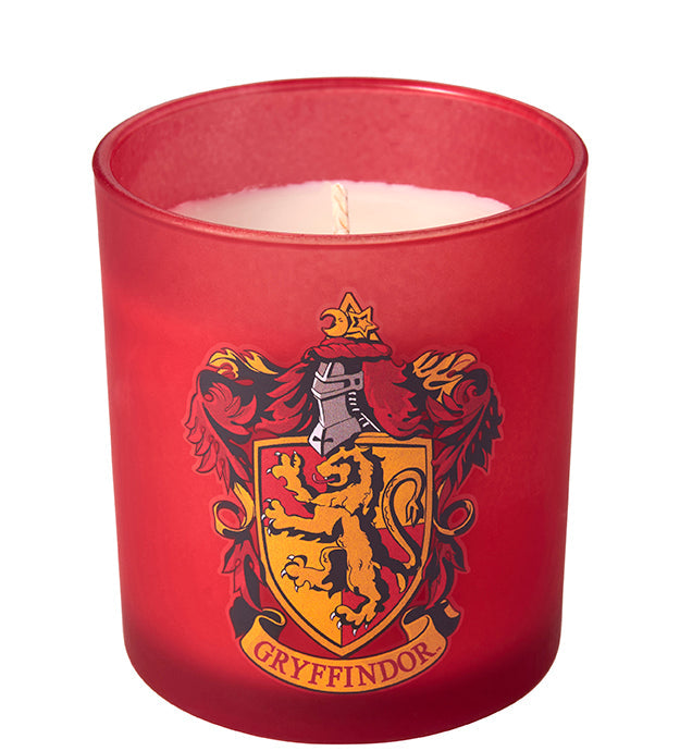 Gryffindor scented glass candle from Harry Potter home goods collection by Insight Editions, featuring a decorative candle with Gryffindor emblem.