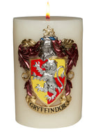 Sculpted Gryffindor crest candle from Harry Potter themed home goods by Insight Editions with detailed insignia design