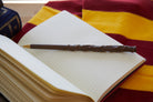 Hermione's Wand Pen from Harry Potter with detailed wand design, ideal for home or office use. Insight Editions home goods.