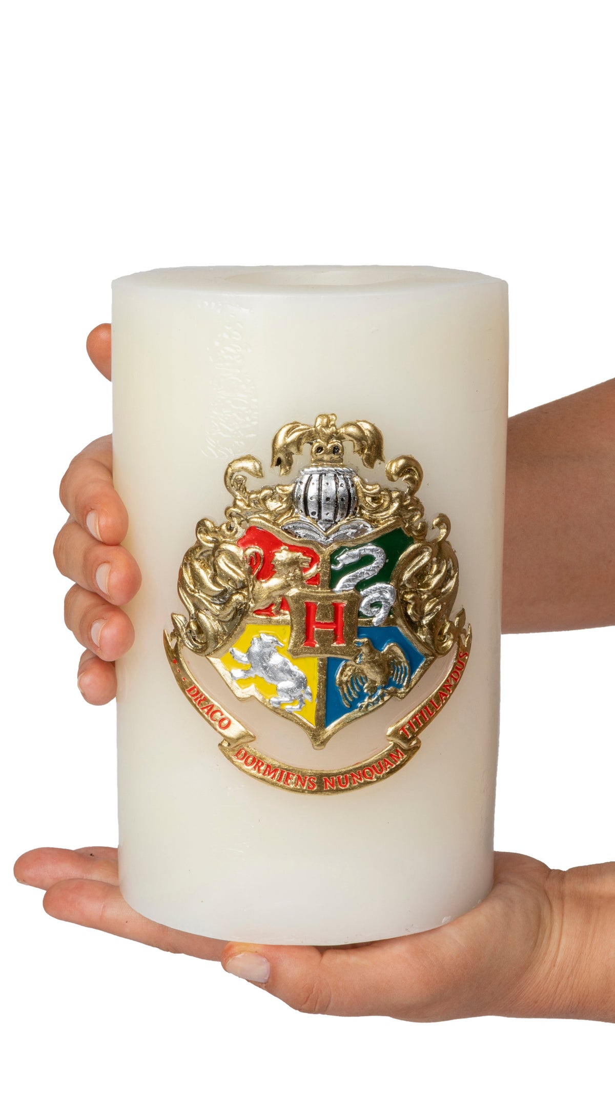 Large Harry Potter Hogwarts insignia candle from Insight Editions, featuring detailed sculpted design for home decor.