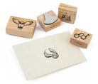 Harry Potter Hogwarts Magical Moments rubber stamp set from Insight Editions, featuring magical wizarding designs on white rubber stamps.