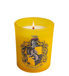 Hufflepuff glass votive candle from Harry Potter home goods collection by Insight Editions, featuring Hufflepuff crest design.