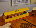 Harry Potter Hufflepuff magnetic pencil box with house crest and yellow accents, ideal for organizing stationery.