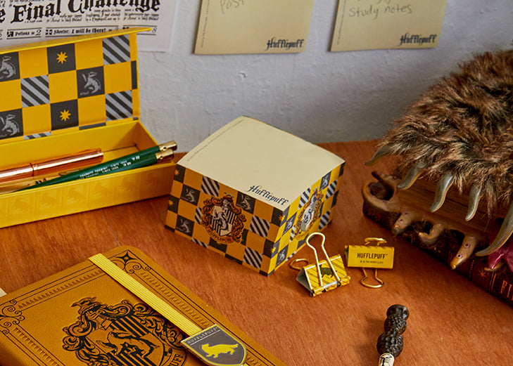 Harry Potter Hufflepuff memo cube from Insight Editions, featuring the house crest and vibrant yellow design for home or office use.