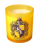 Hufflepuff scented glass candle from Harry Potter home goods collection featuring a decorative candle with Hufflepuff emblem.