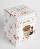 Color-changing Gryffindor candle from Harry Potter series by Insight Editions, featuring the iconic house crest and magical glow.