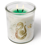 Color-changing Slytherin Harry Potter candle by Insight Editions, featuring magical green glow and intricate Slytherin logo design.