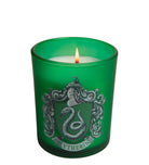 Slytherin glass votive candle from Harry Potter home goods by Insight Editions, featuring green Slytherin house emblem on clear glass.