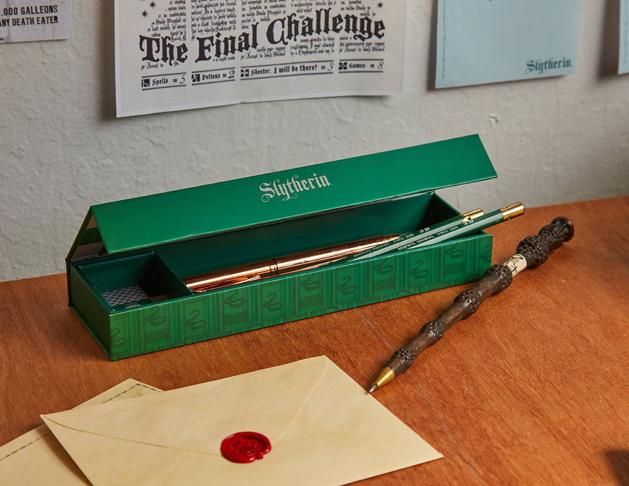 Harry Potter Slytherin magnetic pencil box from Insight Editions with Slytherin emblem and green design for home or school use.