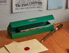 Harry Potter Slytherin magnetic pencil box from Insight Editions with Slytherin emblem and green design for home or school use.