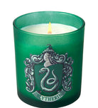 Slytherin scented glass candle from Harry Potter home goods collection by Insight Editions, featuring green glass with Slytherin branding.