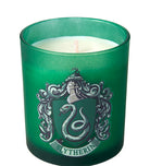 Slytherin scented glass candle from Harry Potter home goods collection by Insight Editions, featuring green glass and Slytherin emblem.