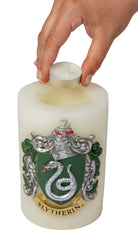 Slytherin insignia candle with sculpted Harry Potter house emblem, green wax, and detailed design from Insight Editions.