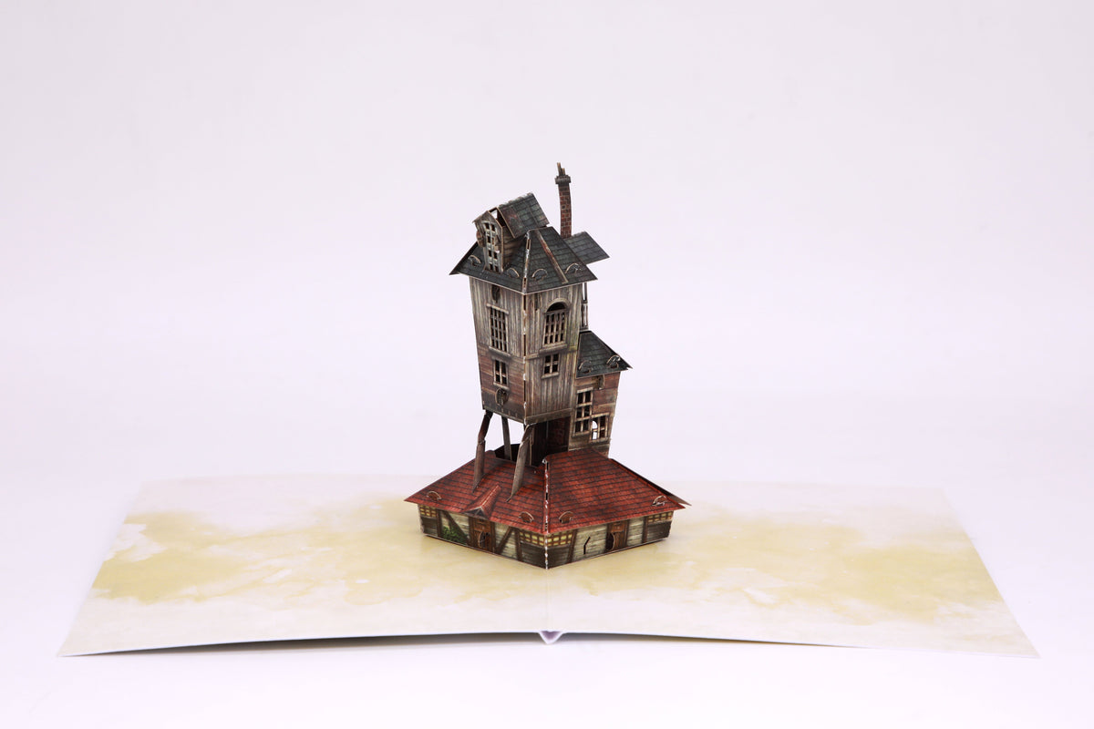 Interior view of Harry Potter The Burrow signature pop-up card by Insight Editions, featuring detailed Hogwarts-style house design.