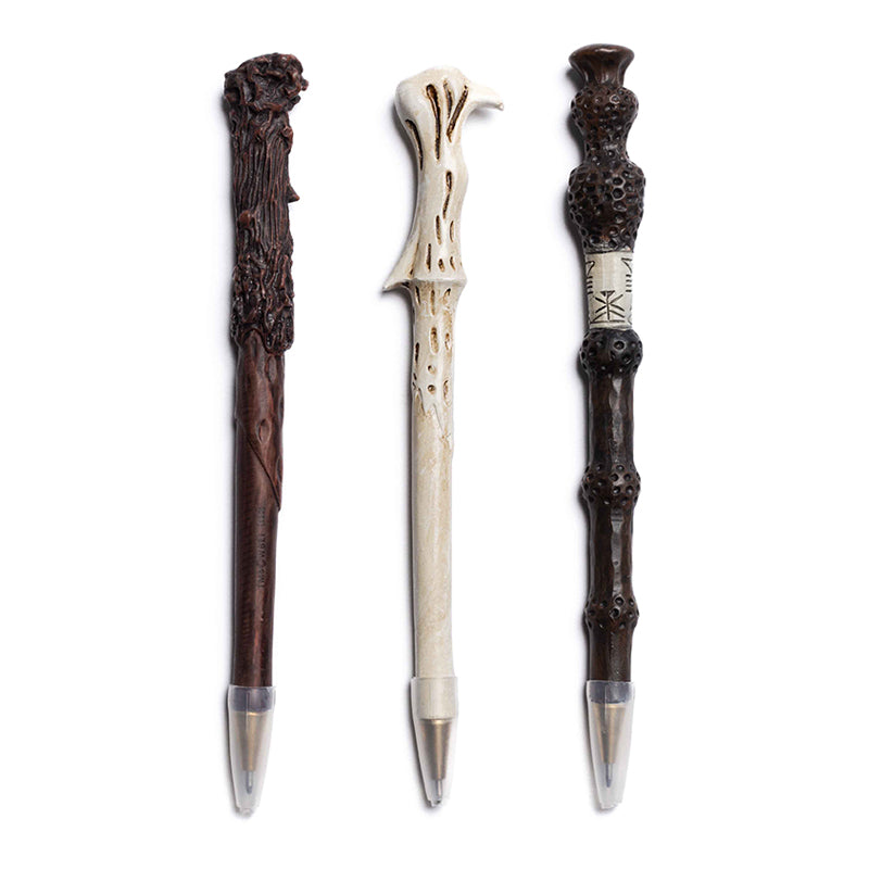 Set of three Harry Potter wand pens from Insight Editions, featuring detailed designs resembling magical wands for home or office use.