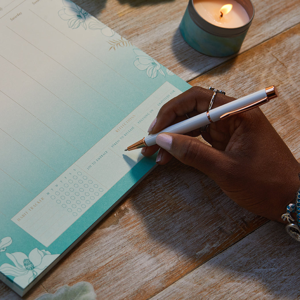 Insight Editions self-care weekly planner notepad for home organization and self-care planning, featuring a clean, organized design.