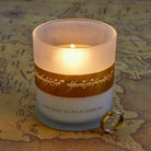 Glass candle holder inspired by The Lord of the Rings One Ring, featuring detailed engravings and a lit candle inside.