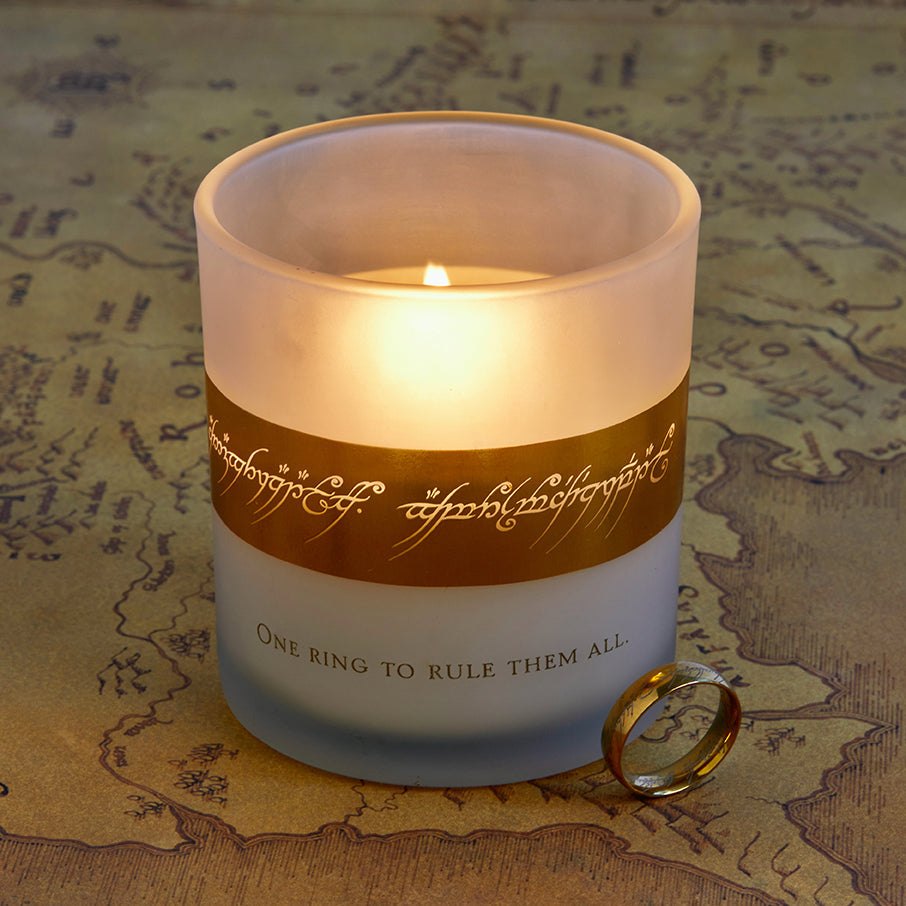 Glass candle holder inspired by The Lord of the Rings One Ring, featuring detailed engravings and a lit candle inside.