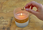 Insight Editions The Lord of the Rings One Ring glass candle in a home decor setting, showcasing the detailed ring design.