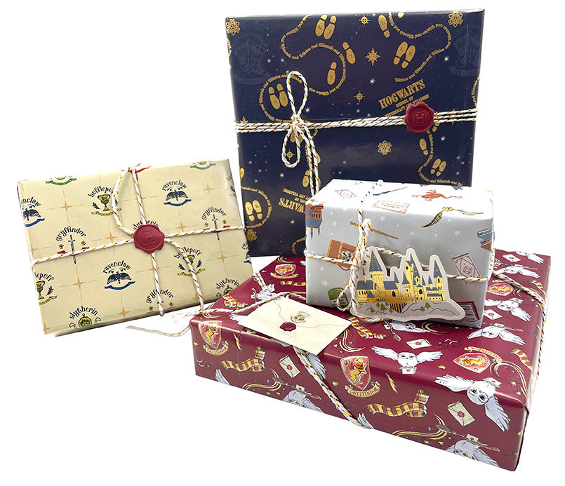 Harry Potter Hogwarts Gift Wrap Stationery Set kit by Insight Editions, featuring wizard-themed wrapping paper and stationery accessories.