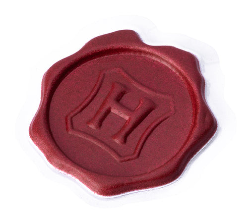 Set of 50 Harry Potter Hogwarts sticker seals from Insight Editions kit featuring magical house crests and wizarding symbols.