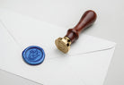 Harry Potter Ravenclaw wax seal set kit with blue wax, Ravenclaw emblem stamp, and sealing accessories from Insight Editions.