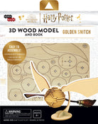 Insight Editions Harry Potter Golden Snitch 3D wood model kit with accompanying book, featuring detailed craftsmanship and packaging.