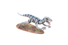 IncrediBuilds Jurassic World Raptor 3D wood model kit with instruction book, featuring detailed raptor design and wooden pieces.