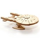 IncrediBuilds Star Trek The Next Generation U.S.S. Enterprise NCC-1701-D 3D wood model kit with an accompanying book, detailed and assembled.