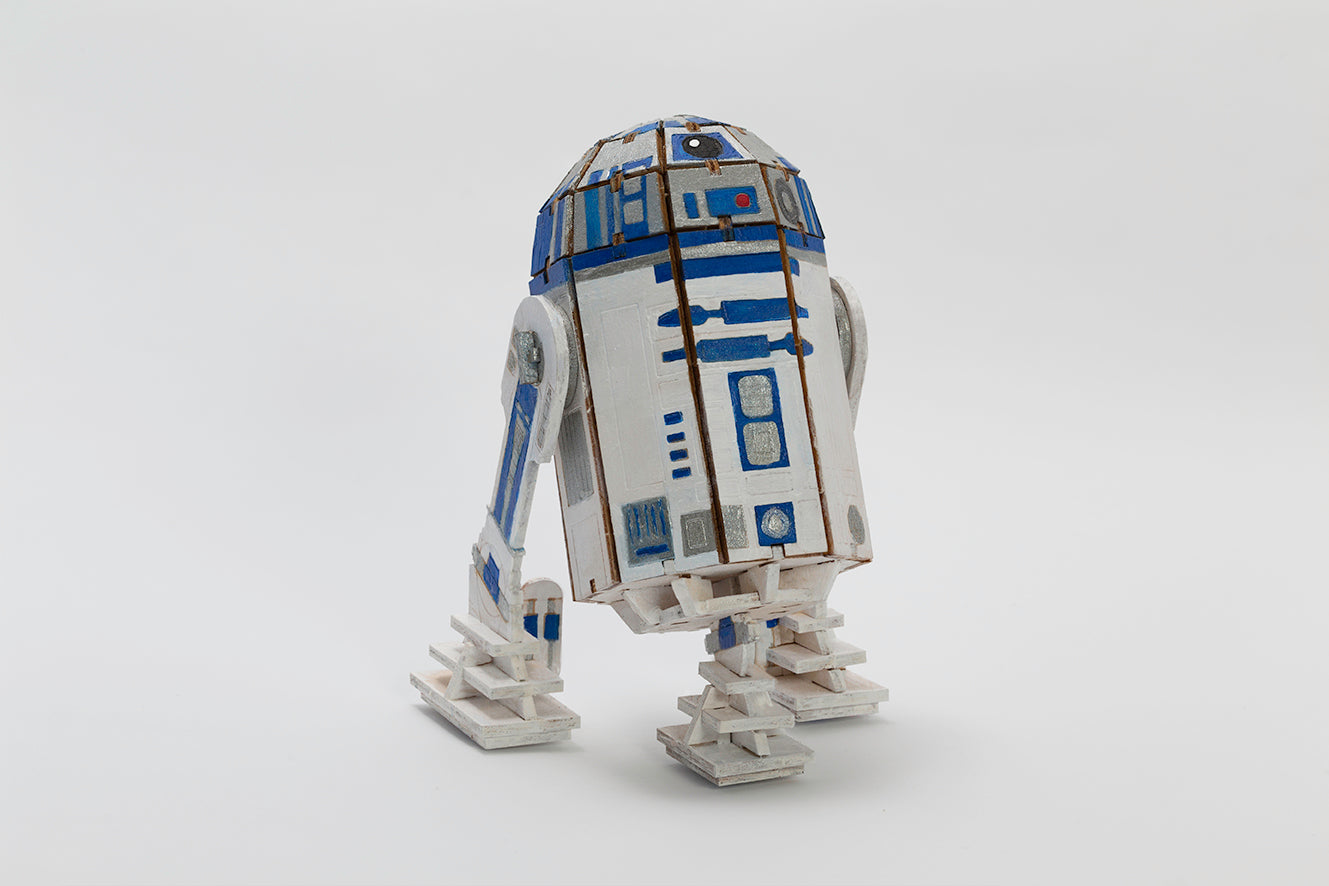 IncrediBuilds Star Wars R2-D2 3D wood model kit with book, featuring detailed R2-D2 design and assembly parts.