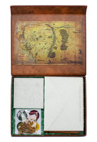 Inside view of Insight Editions' The Lord of the Rings: One Ring stationery kit featuring themed pens, paper, and accessories.