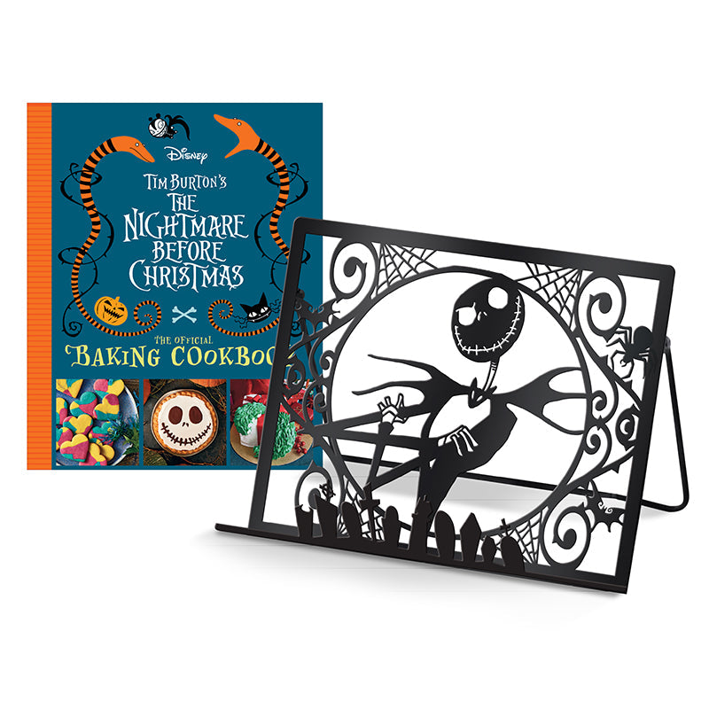 Inside the Tim Burton's The Nightmare Before Christmas baking cookbook gift set, featuring themed recipe pages and baking tools.