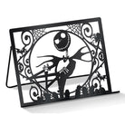 Inside view of Tim Burton's The Nightmare Before Christmas baking cookbook gift set by Insight Editions, featuring recipe pages and baking tools.