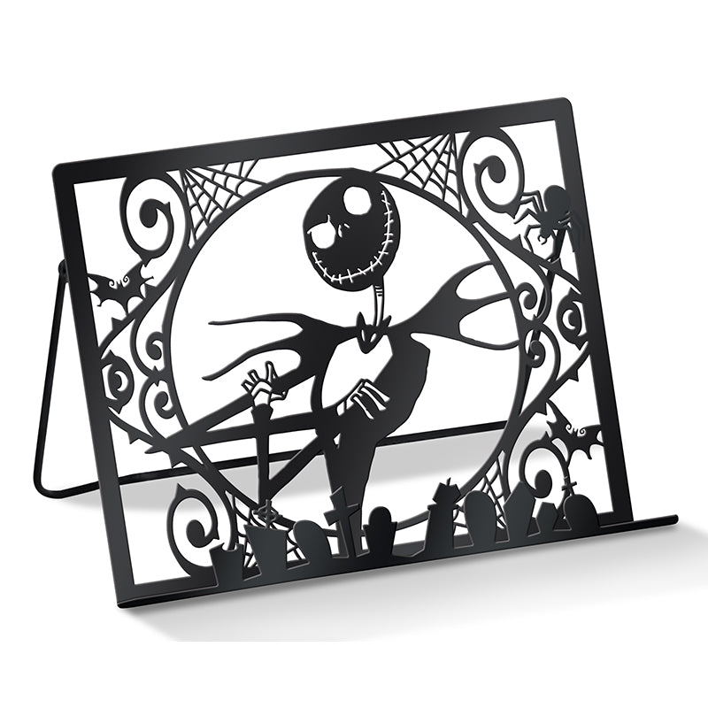 Inside view of Tim Burton's The Nightmare Before Christmas baking cookbook gift set by Insight Editions, featuring recipe pages and baking tools.
