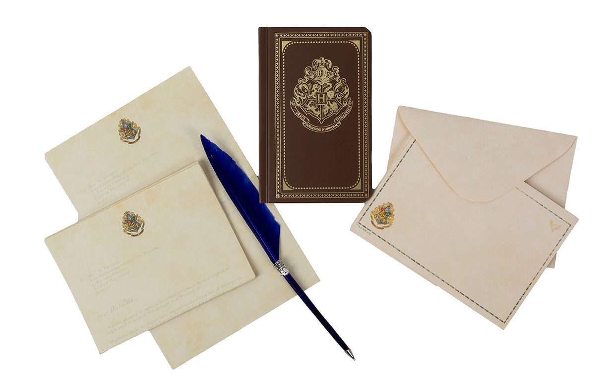 Harry Potter Hogwarts School of Witchcraft and Wizardry desktop stationery set with pen, featuring themed notebooks and writing accessories.