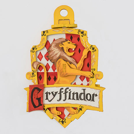 Harry Potter Gryffindor IncrediBuilds Emblematics kit with stationery and collectible emblem, featuring house crest and themed accessories.